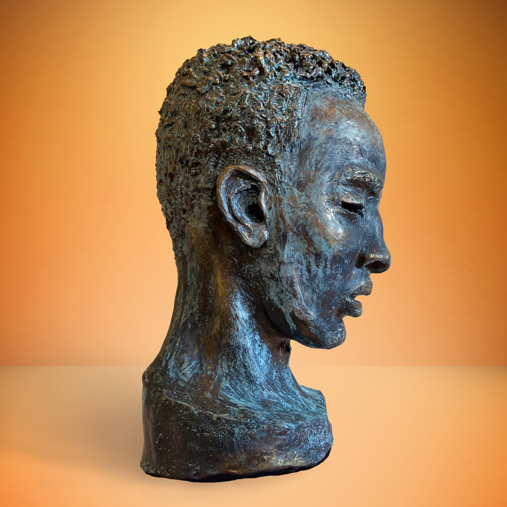 This is an image of sculpture "A Young Man Meditating" by Rachel Dolezal